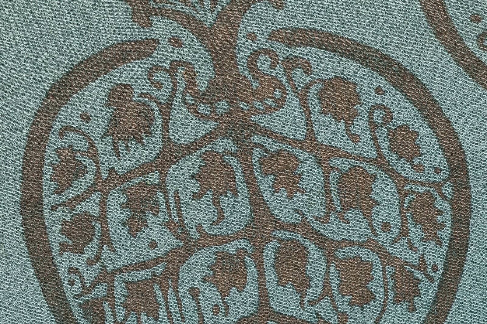 Gold ornament on silk, close-up